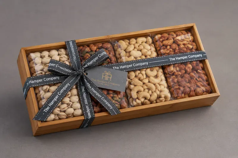 Top view of handcrafted wooden dry fruits platter showing premium nut assortment with decorative arrangement