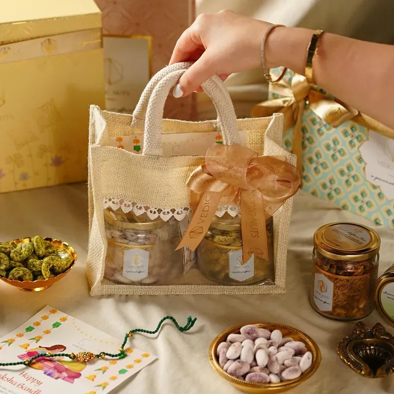 Rakhi Gift Hamper with Jute Potli & Dry Fruits by The Hamper Company — ₹999 onwards, custom branded, PAN India delivery