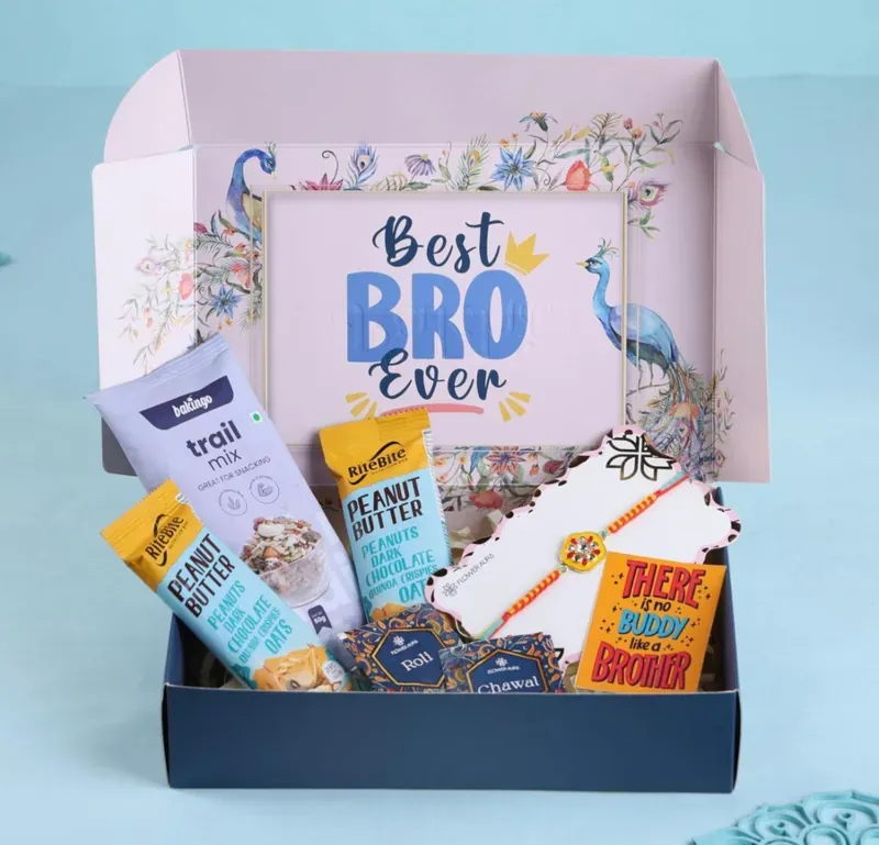 Inside view of Best Bro Ever Rakhi gift hamper showing curated snacks and sweet treats arrangement
