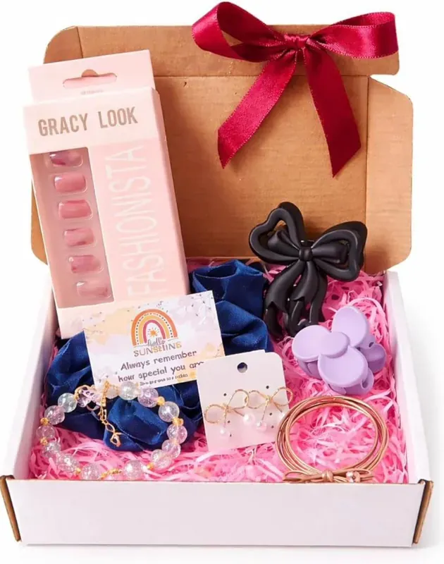 Inside view of women's accessories gift box showing curated beauty and self-care items arrangement