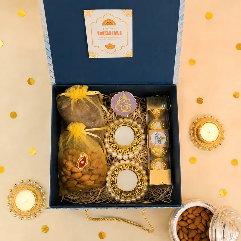 Inside view of premium dry fruits box with almonds, cashews, pistachios, and Kahwa tea sachets